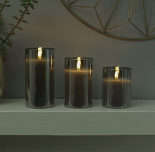 Festive Lights - 3 Pack of Grey LED Real Wax Candles in Smoked Glass Cylinder - Authentic Flickering Flame on Realistic Black Wick - Battery Operated with Time (With Remote)